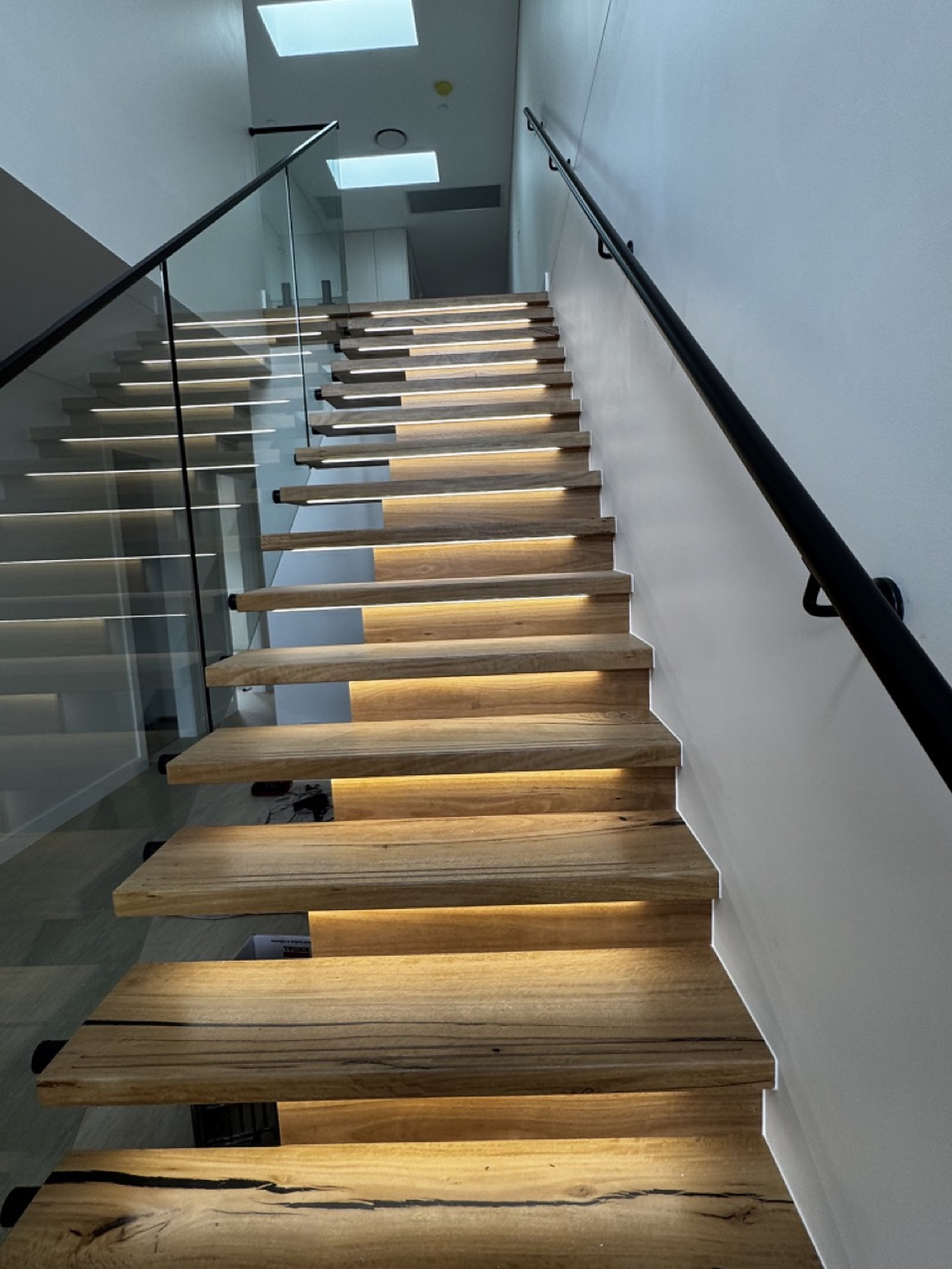 LED illuminated floating staircase at Guildford duplex